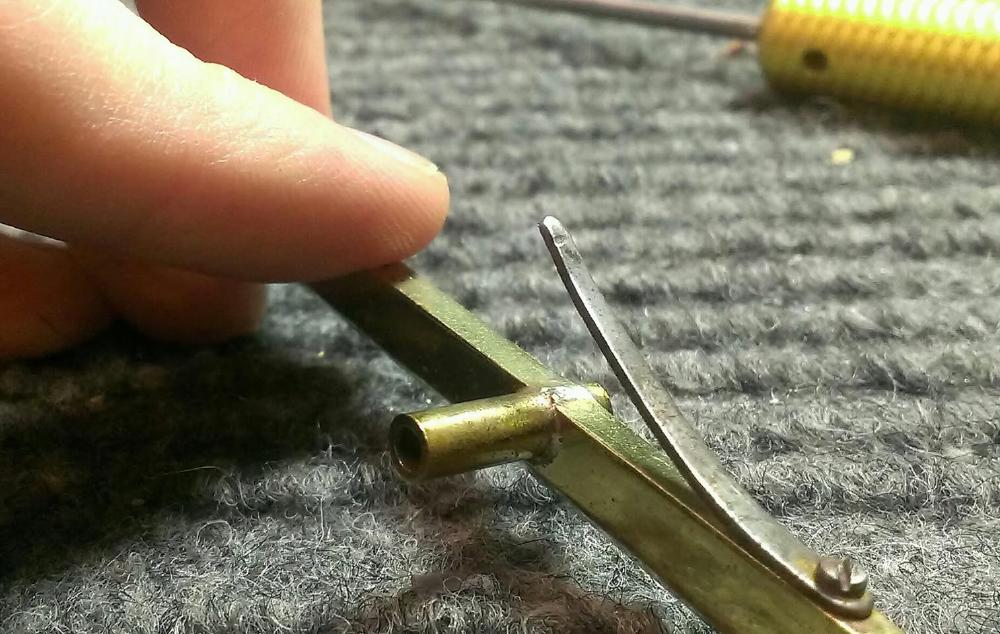 Tiny groove worn in a flat spring at the end. This can contribute to a sloppy or binding feeling on keys with flat springs. You can sand or file or dremel it smooth so that it won't 'catch' in the spring receiver.