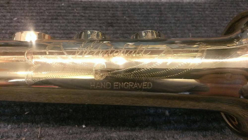 'Hey, let's hand engrave HAND ENGRAVED on this thing.'