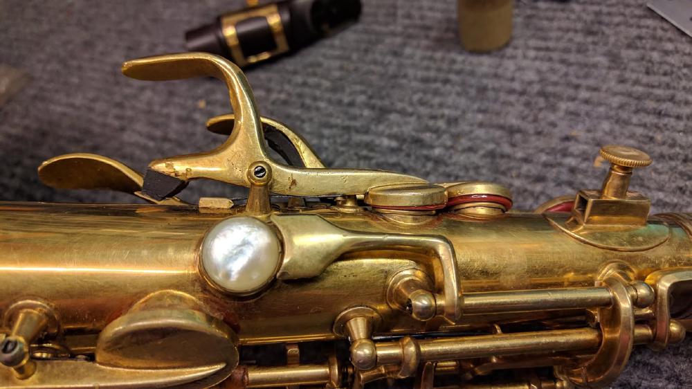 Lots wrong here! That key needs straightened out so the adjustment material is not so massive and the pad will fit evenly in the keycup when the pad is sealing well against the tonehole.