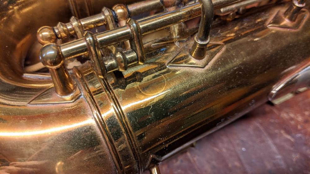 Alternate Eb tonehole brazed shut from the factory on a Buescher Aristocrat. For a few horns right as that feature disappeared, it seems like they cut the tonehole but never pulled it, and brazed it shut before continuing on as usual.