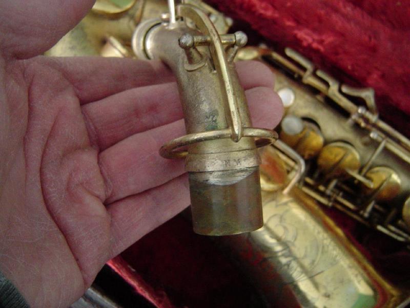 Conn “NM” stamp transitional alto neck detail, serial 234991, from eBay.