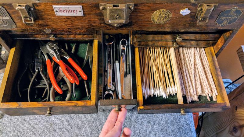 Assorted pliers (flat, round nose, duckbill, spring cutting, spring installing, spring removing, parallel, Utica 1300-6, whole spring removal pliers, tiny adjustable wrench), swedging collets, pipe cleaners and q-tips.